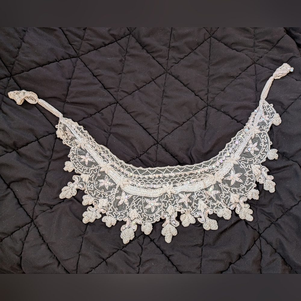 White lace and beaded scarf wrap.